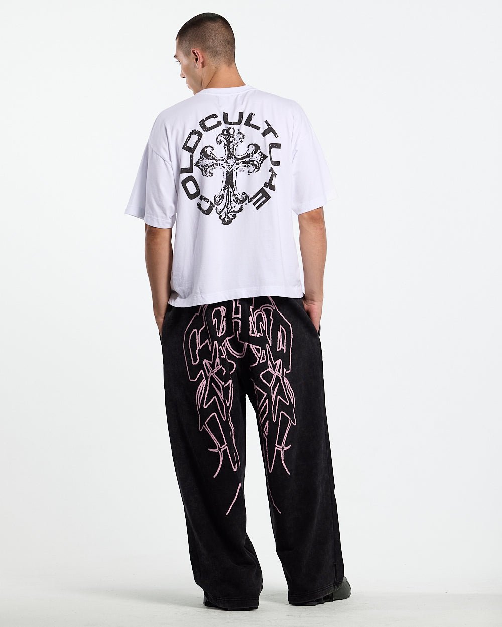 55 SWEATPANTS BLACK - washed black graphic sweatpants, back view on male model - Cold Culture