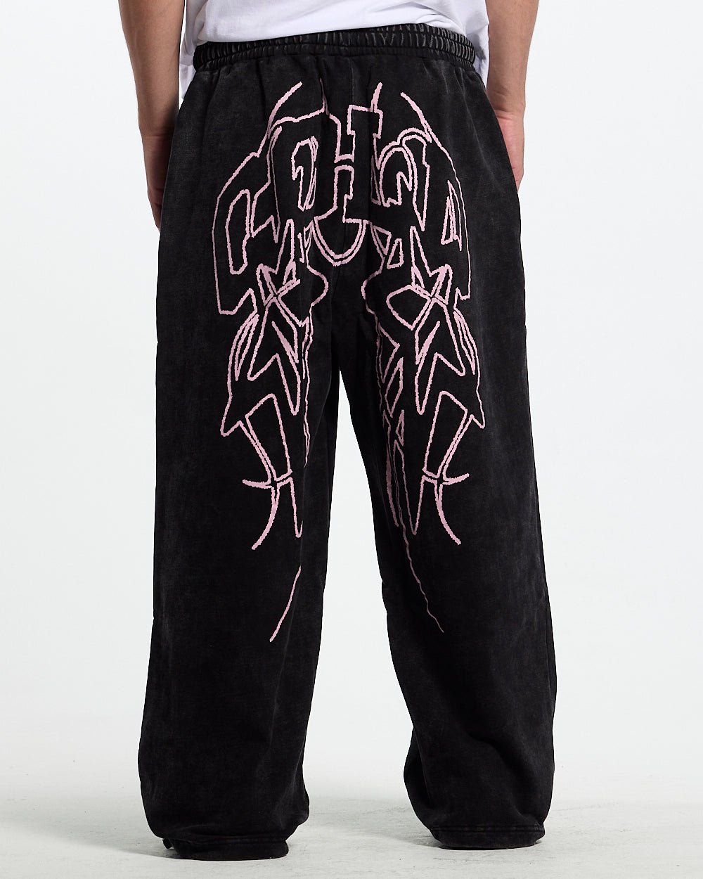 55 SWEATPANTS BLACK - washed black graphic sweatpants, back view on male model - Cold Culture