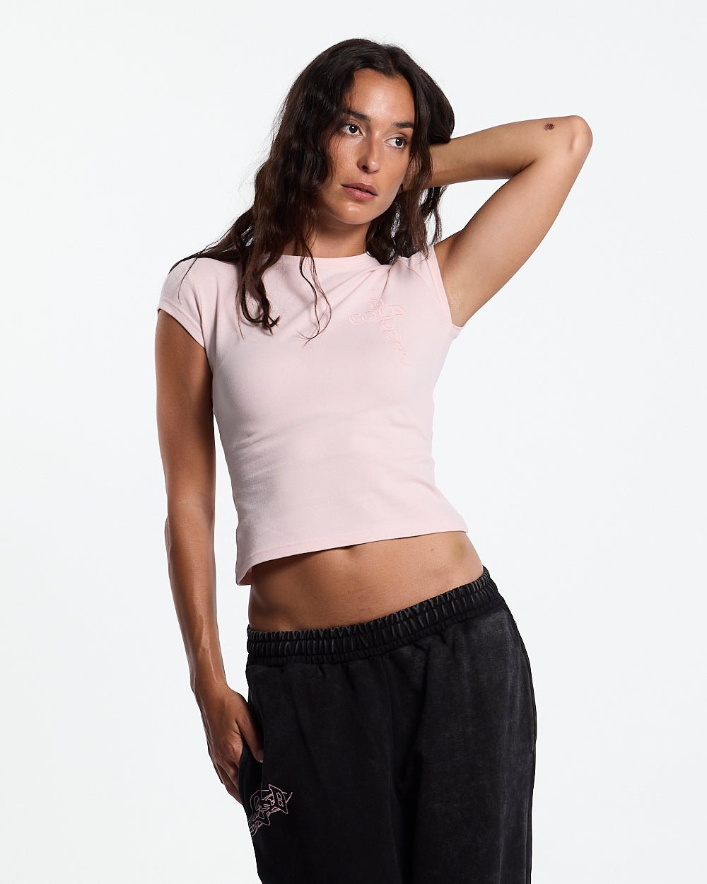 55 SWEATPANTS BLACK - washed black graphic sweatpants, front view on female model - Cold Culture