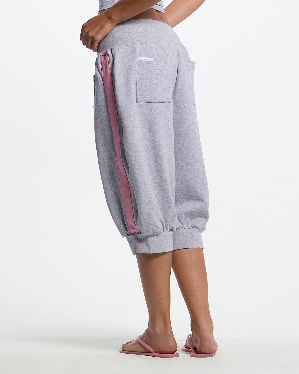 B-BOY CAPRI PANTS HEATHER GREY - heather grey capri sweatpants, back view on female model - Cold Culture