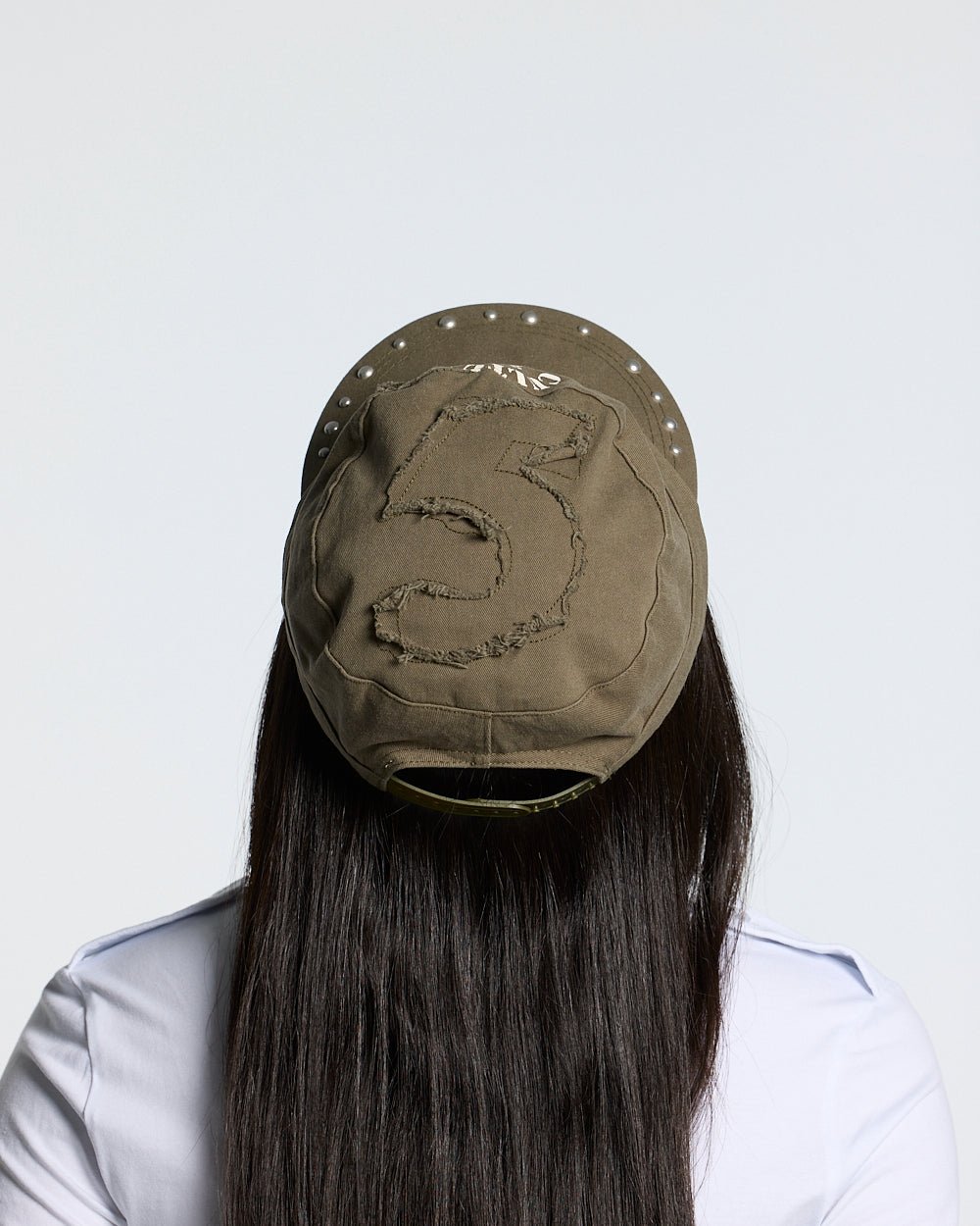 BOSSMAN CAP BROWN - brown studded cap, back view on female model - Cold Culture