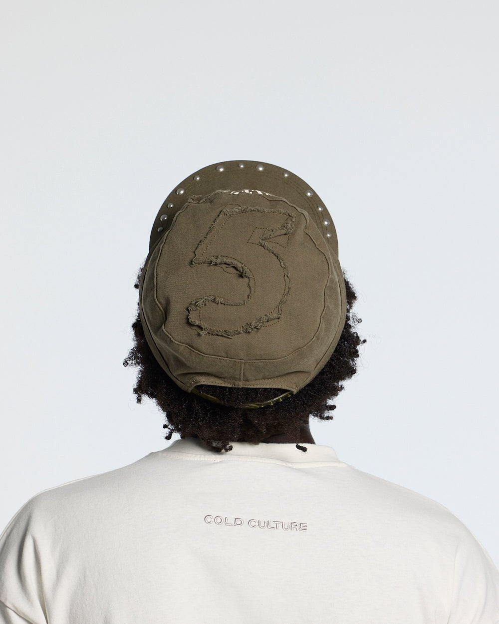 BOSSMAN CAP BROWN - brown studded cap, back view on male model - Cold Culture