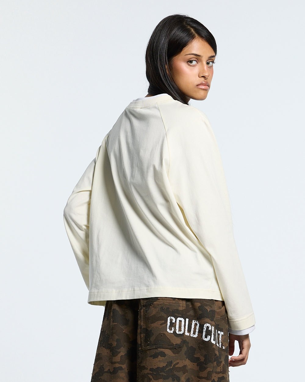CAPUCCINO LONGSLEEVE CREAM - cream longsleeve tee, back view on female model - Cold Culture