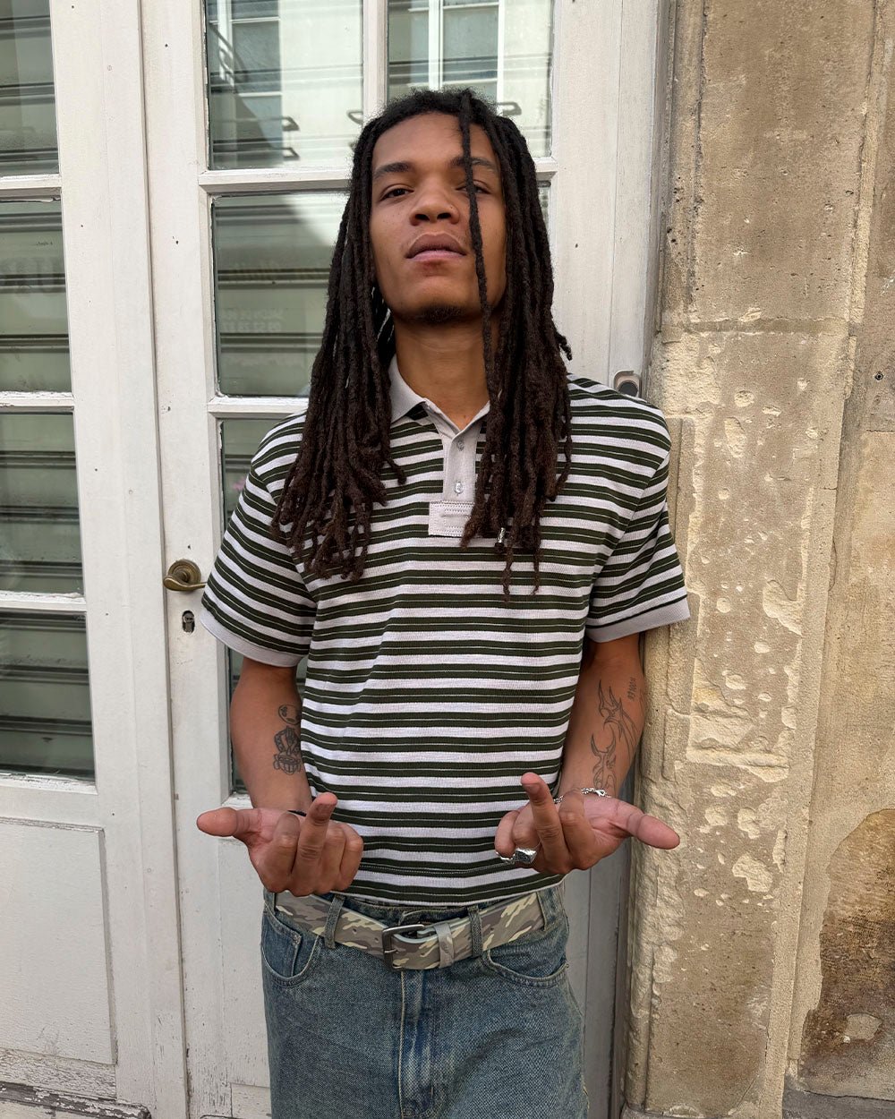 COURT FIELD KNIT POLO GREEN - green striped knit polo, street style shot - Cold Culture