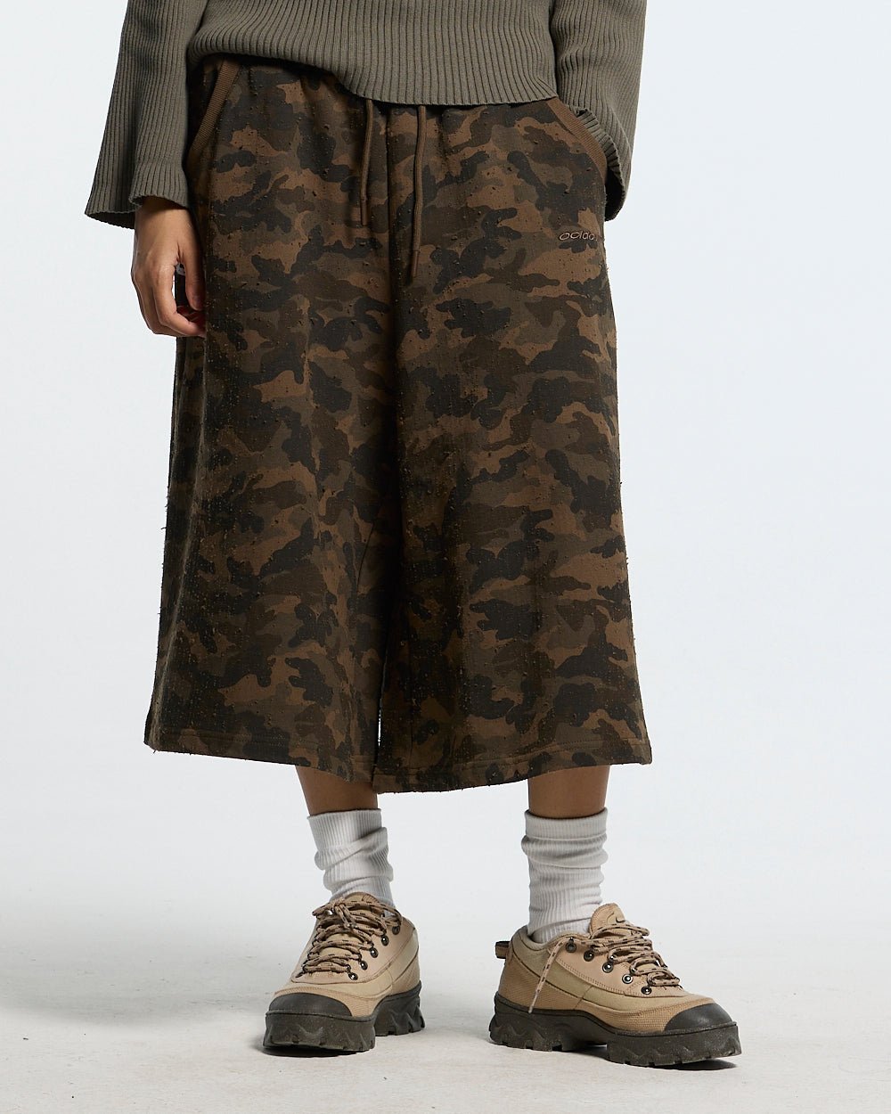 FRONT LINE JORTS GREEN - green camo shorts, front view on female model - Cold Culture
