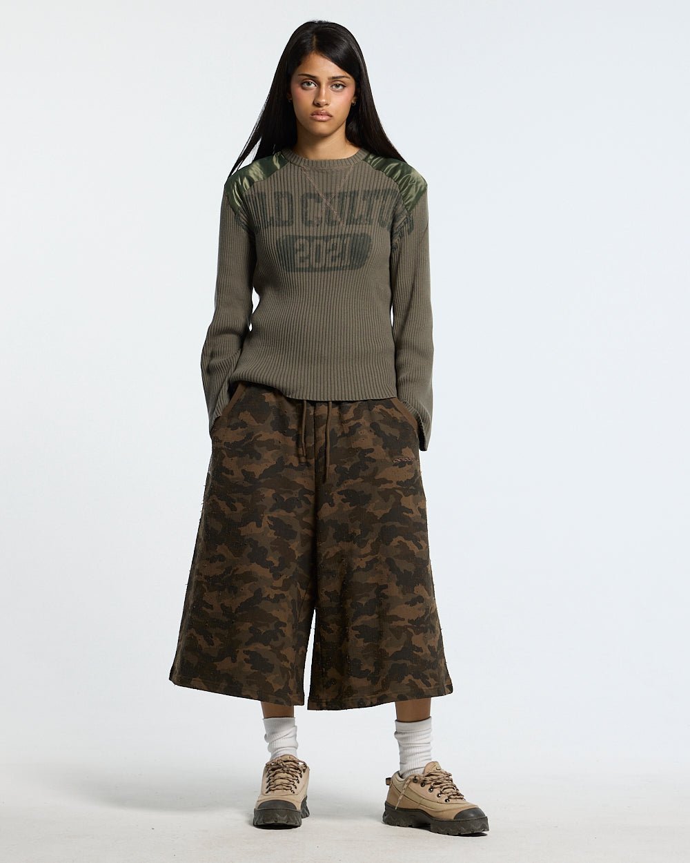 FRONT LINE JORTS GREEN - green camo shorts, front view on female model - Cold Culture