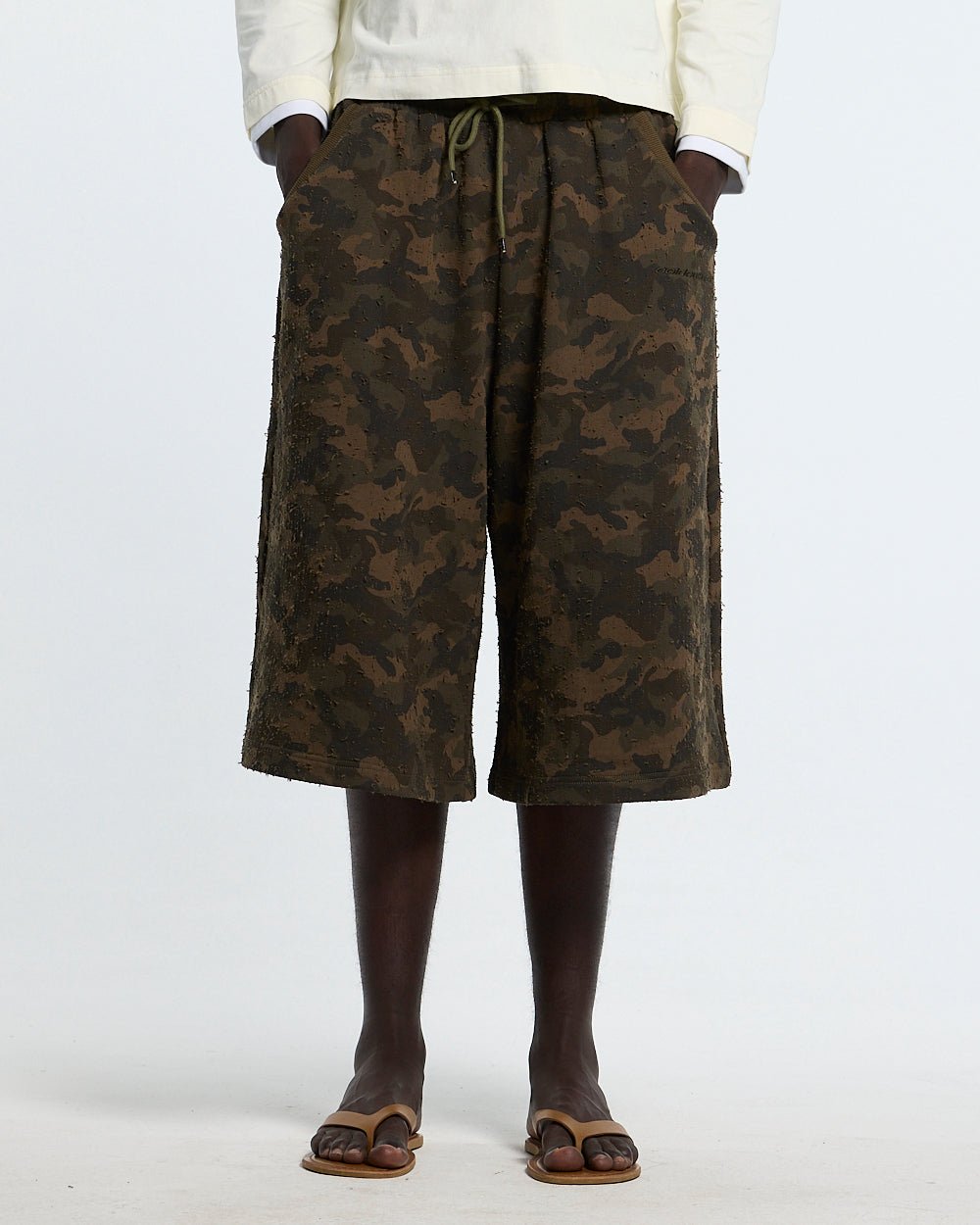 FRONT LINE JORTS GREEN - green camo shorts, front view on male model - Cold Culture
