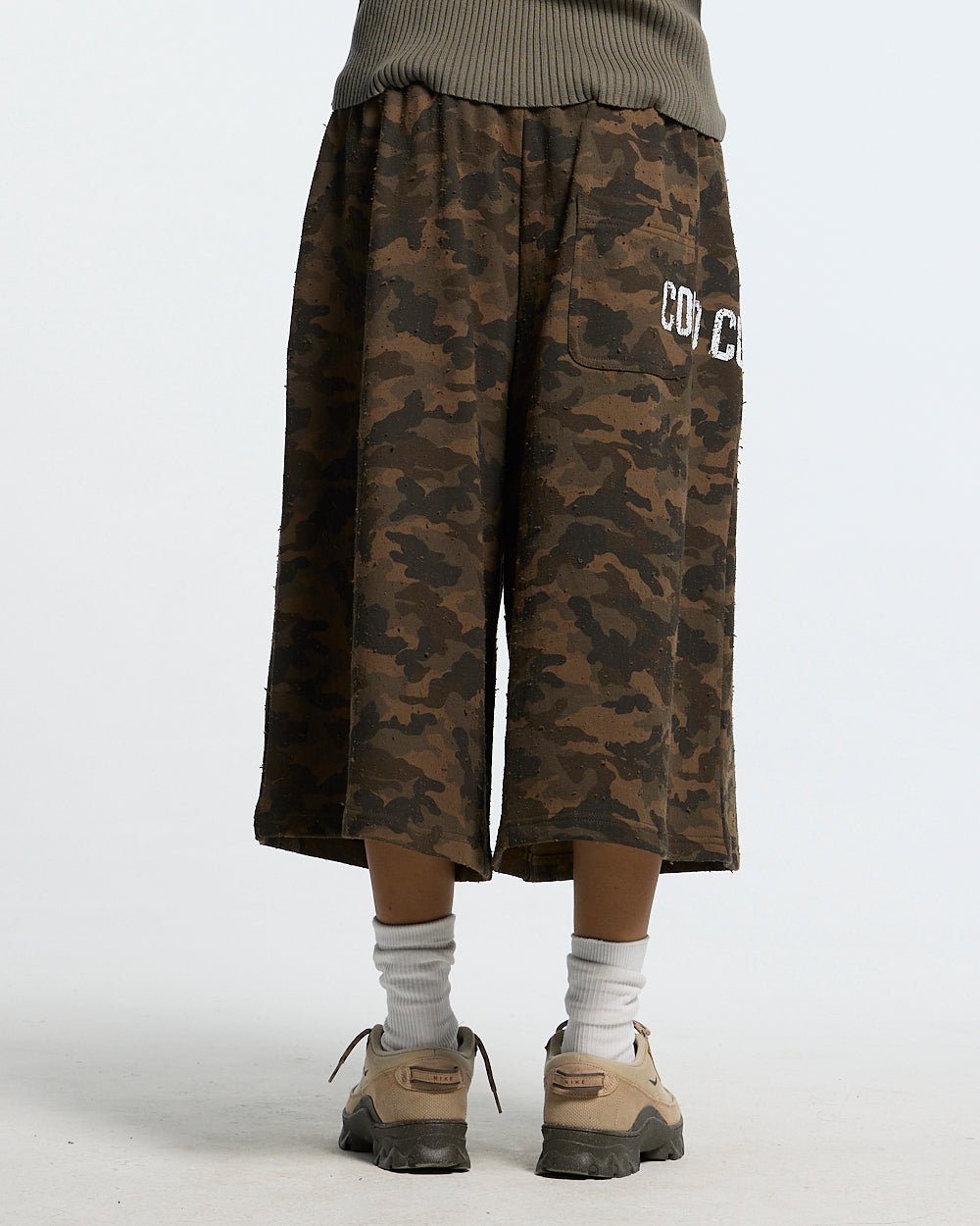 FRONT LINE JORTS GREEN - green camo shorts, back view on female model - Cold Culture