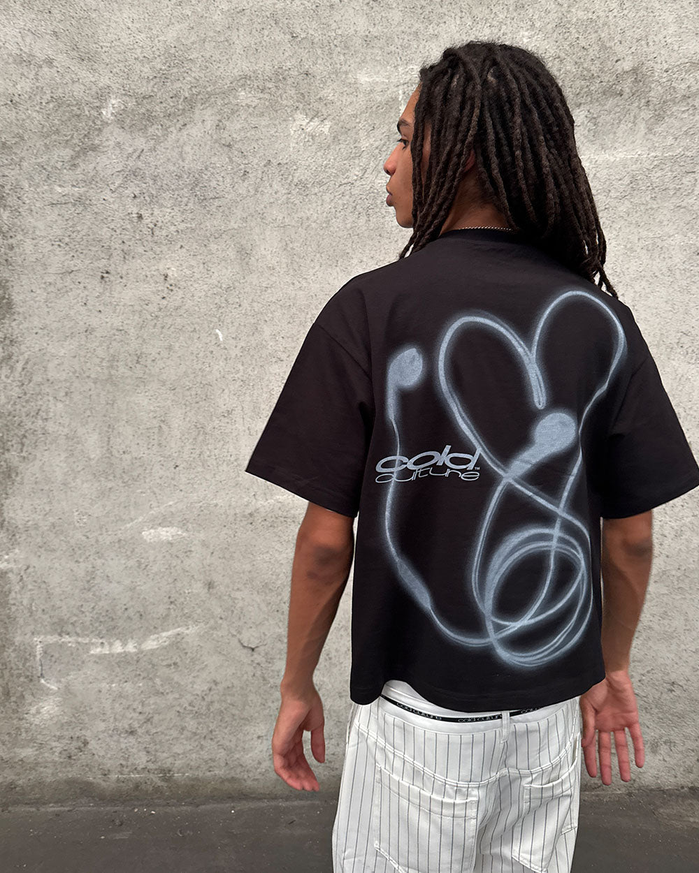 LOVEPODS TEE BLACK - black graphic print tee, back view on male model - Cold Culture
