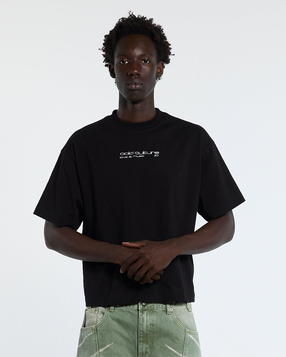 LOVEPODS TEE BLACK - black graphic print tee, front view on male model - Cold Culture