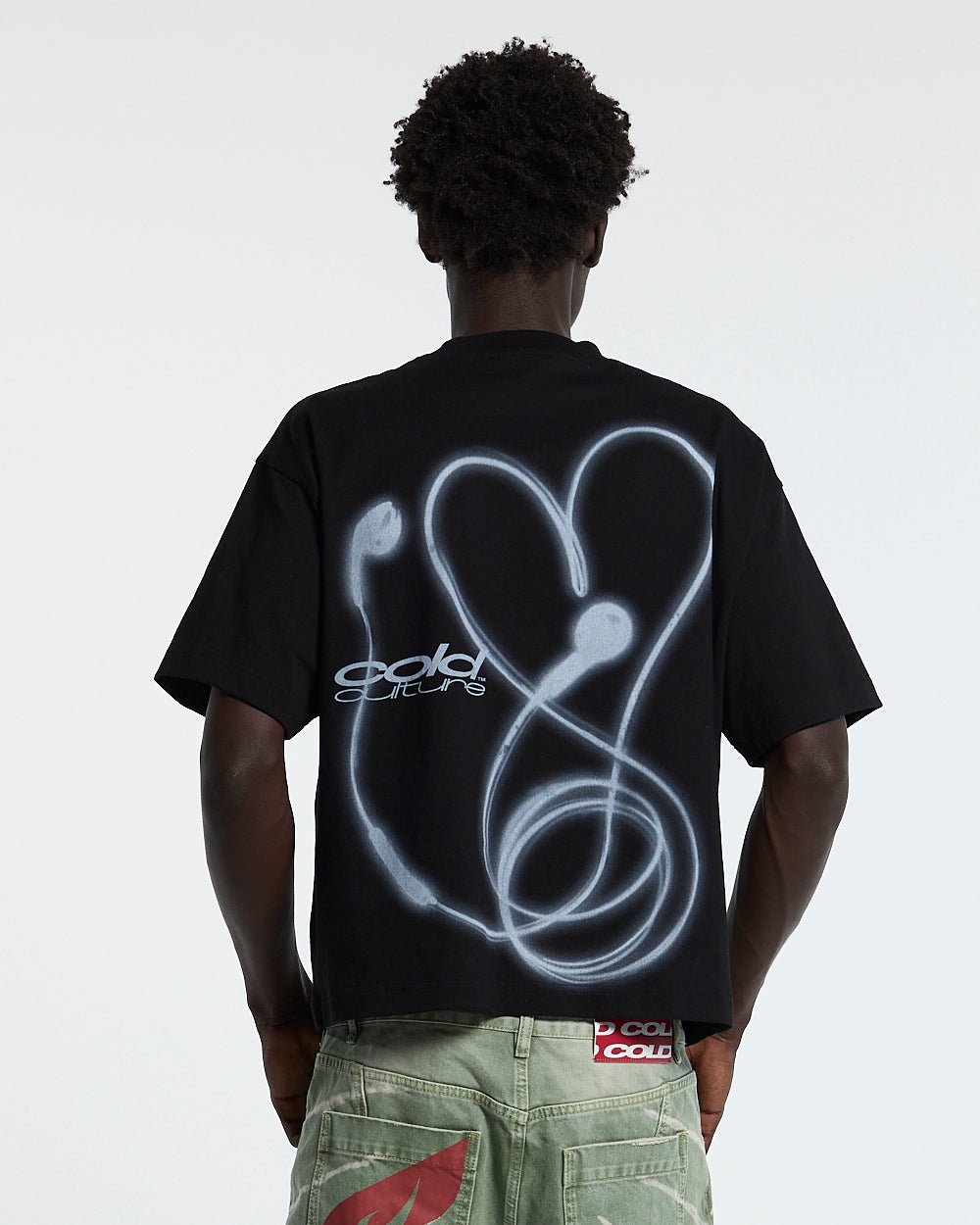 LOVEPODS TEE BLACK - black graphic print tee, back view on male model - Cold Culture