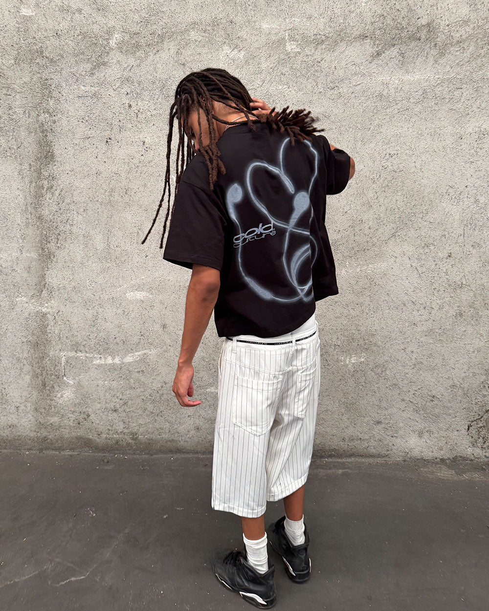 LOVEPODS TEE BLACK - black graphic print tee, street style shot - Cold Culture