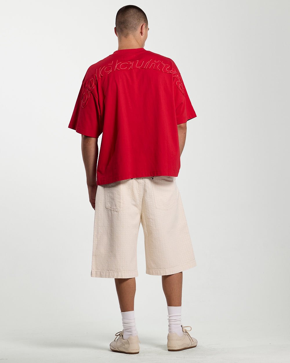 NEEDLE PUNCH SHORT WHITE - off-white textured shorts, back view on male model - Cold Culture