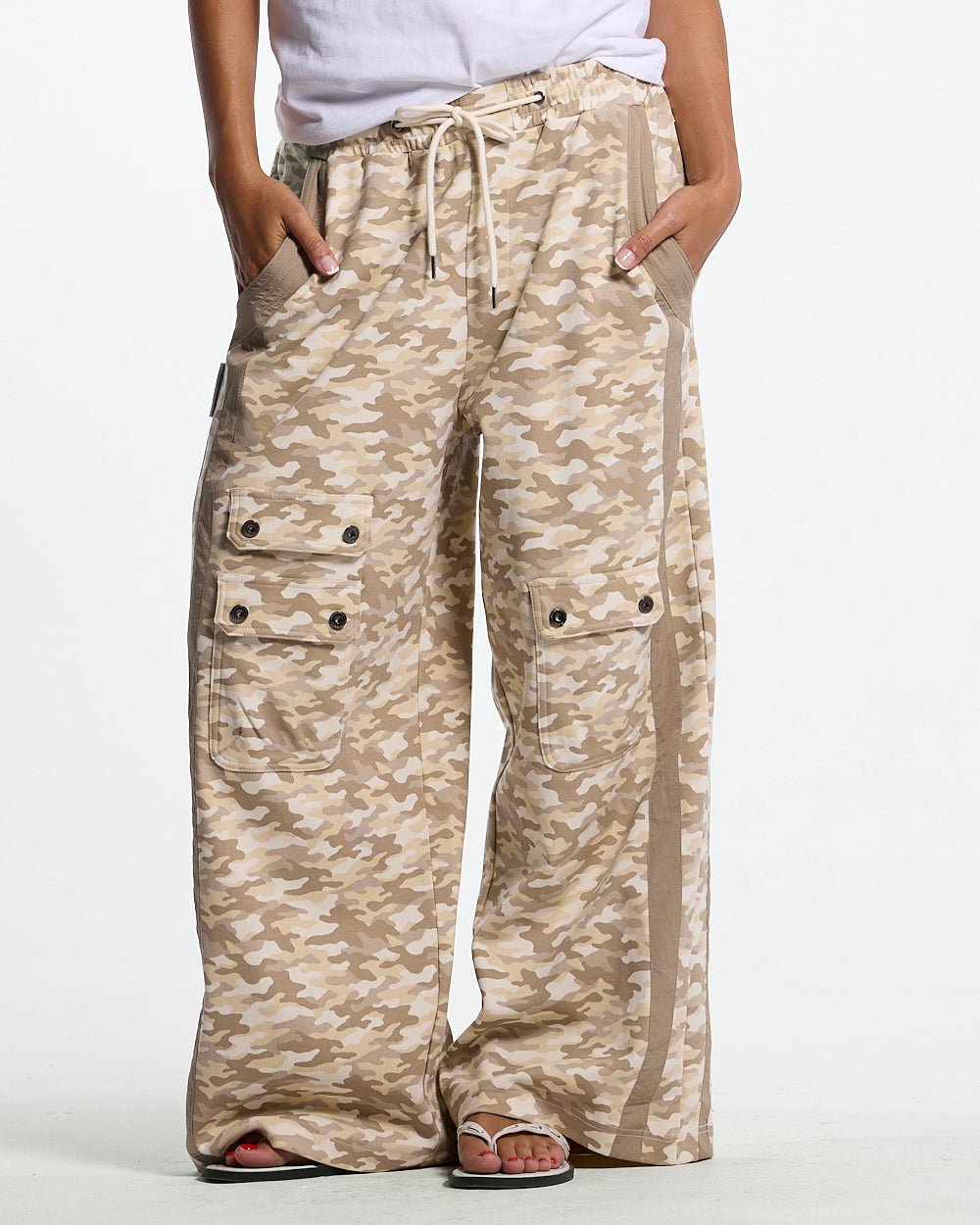 NEUTRAL FIELD SWEATPANTS CAMO - beige camo sweatpants, front view on female model - Cold Culture