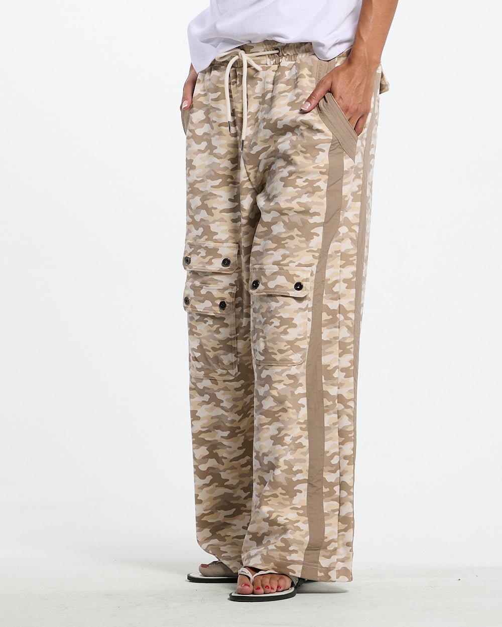 NEUTRAL FIELD SWEATPANTS CAMO - beige camo sweatpants, front view on female model - Cold Culture