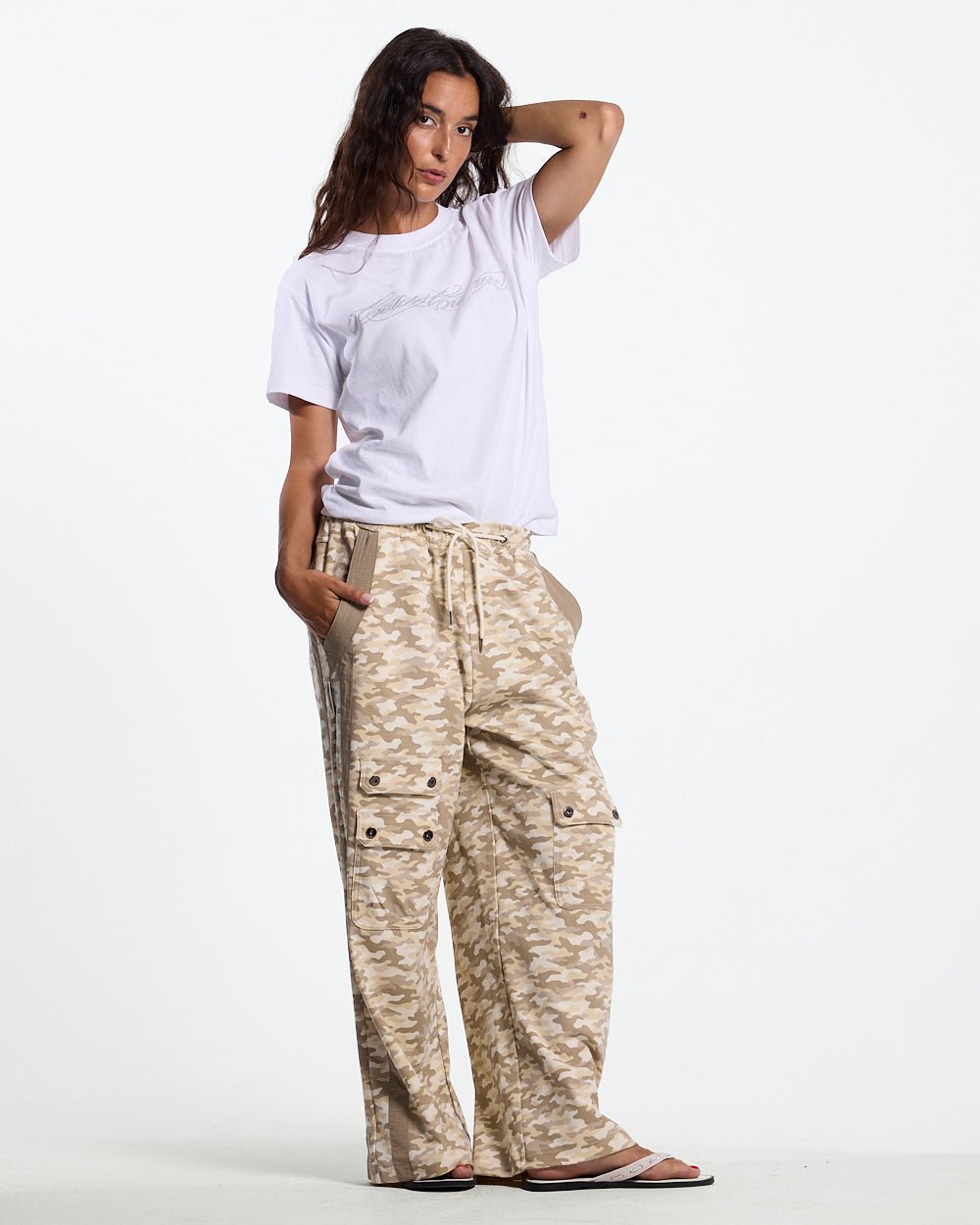 NEUTRAL FIELD SWEATPANTS CAMO - beige camo sweatpants, front view on female model - Cold Culture