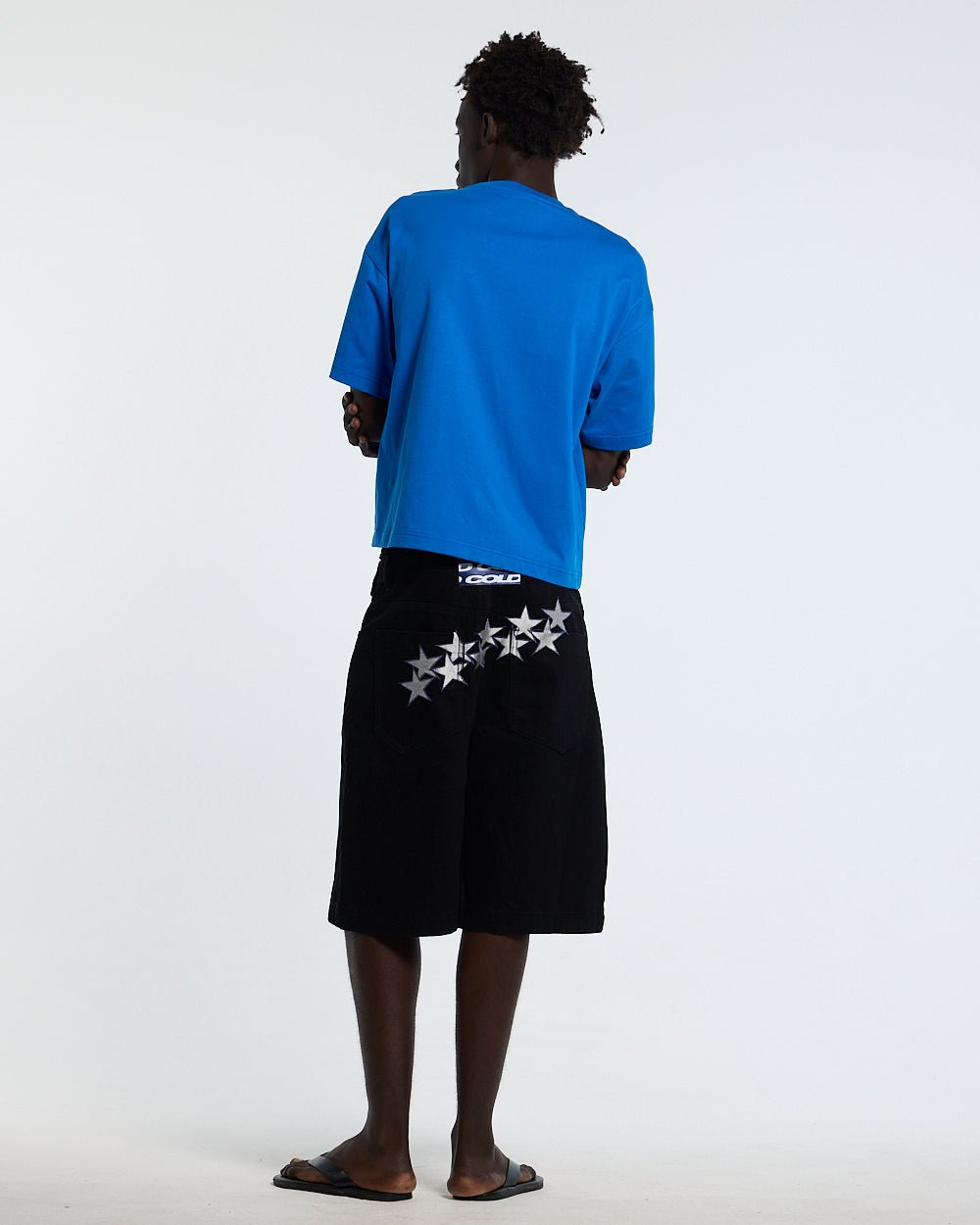 OOPS! TEE BLUE - blue graphic print tee, back view on male model - Cold Culture