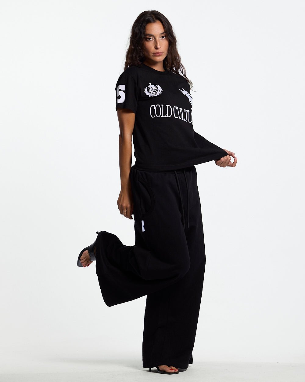 RIDING CLUB POLO BLACK - black embroidered polo shirt, front view on female model - Cold Culture