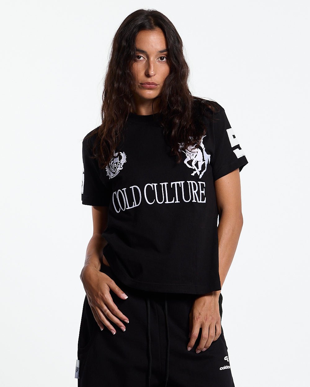 RIDING CLUB POLO BLACK - black embroidered polo shirt, front view on female model - Cold Culture #woman