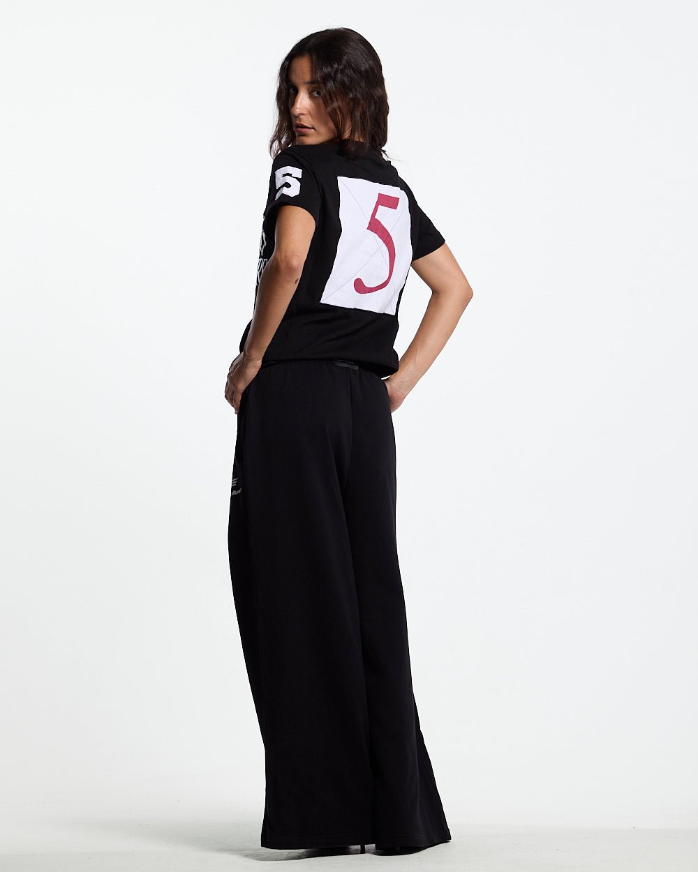 RIDING CLUB POLO BLACK - black embroidered polo shirt, back view on female model - Cold Culture