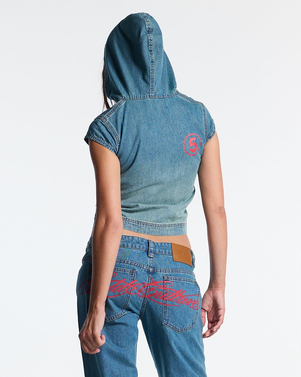 SIGHT ZIP BABY TEE DENIM - washed denim zip tee, back view on female model - Cold Culture