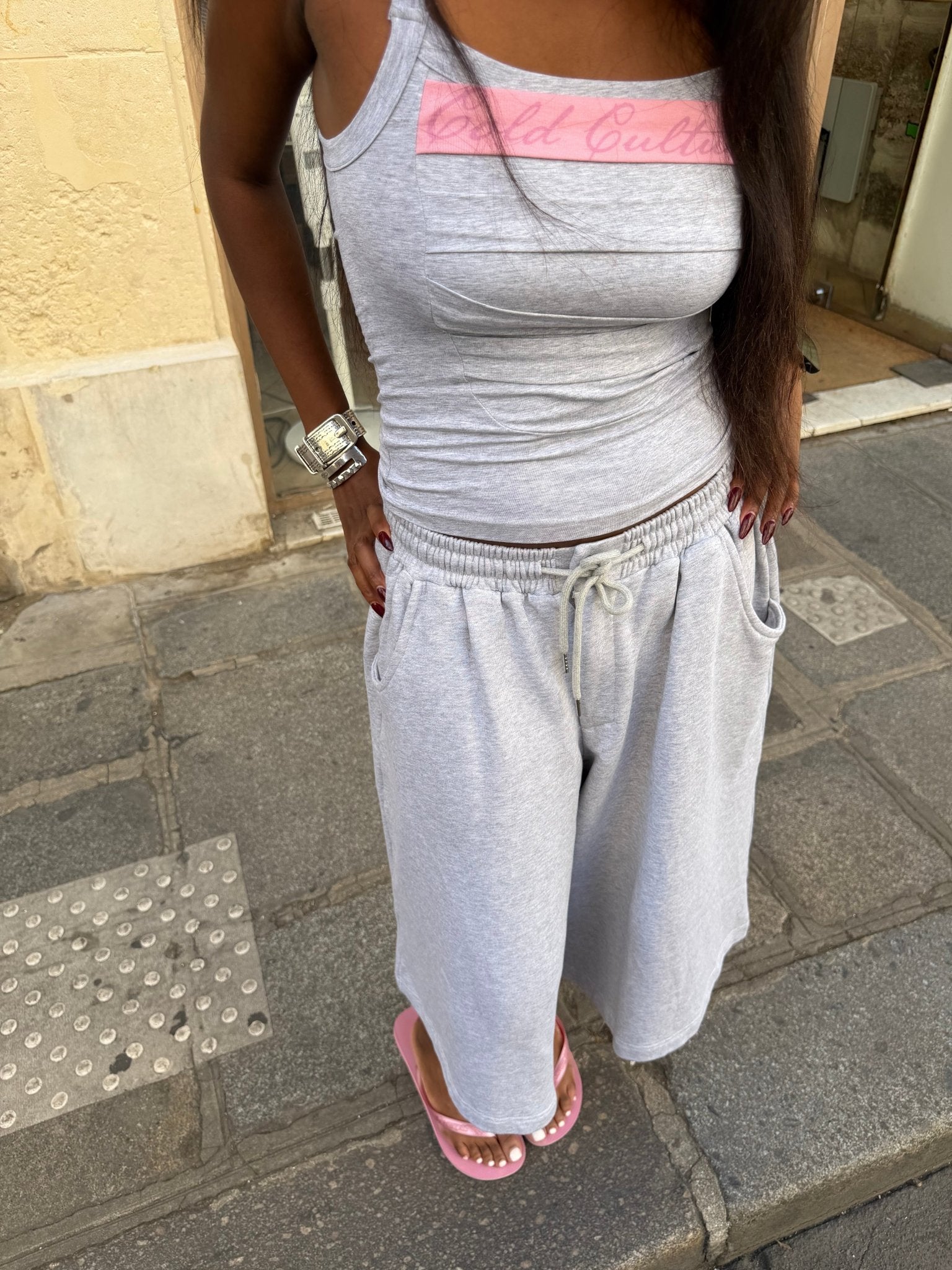 STRAPLINE TANK TOP HEATHER GREY - heather grey pleated tank top, on model close-up - Cold Culture