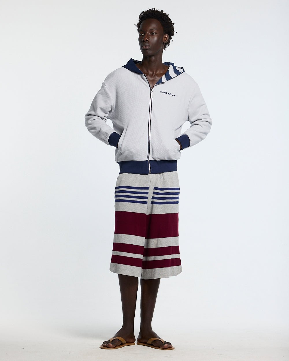 UNTRUE WAFFLE REVERSIBLE ZIP HOODIE BLUE - navy striped reversible zip-up hoodie, front view on male model - Cold Culture