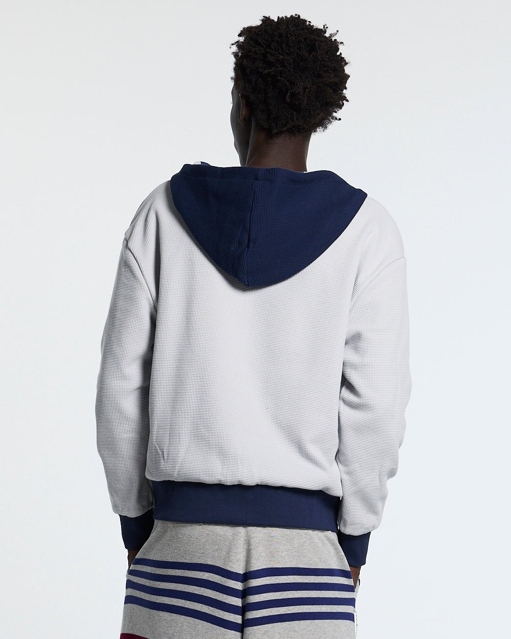 UNTRUE WAFFLE REVERSIBLE ZIP HOODIE BLUE - navy striped reversible zip-up hoodie, back view on male model - Cold Culture