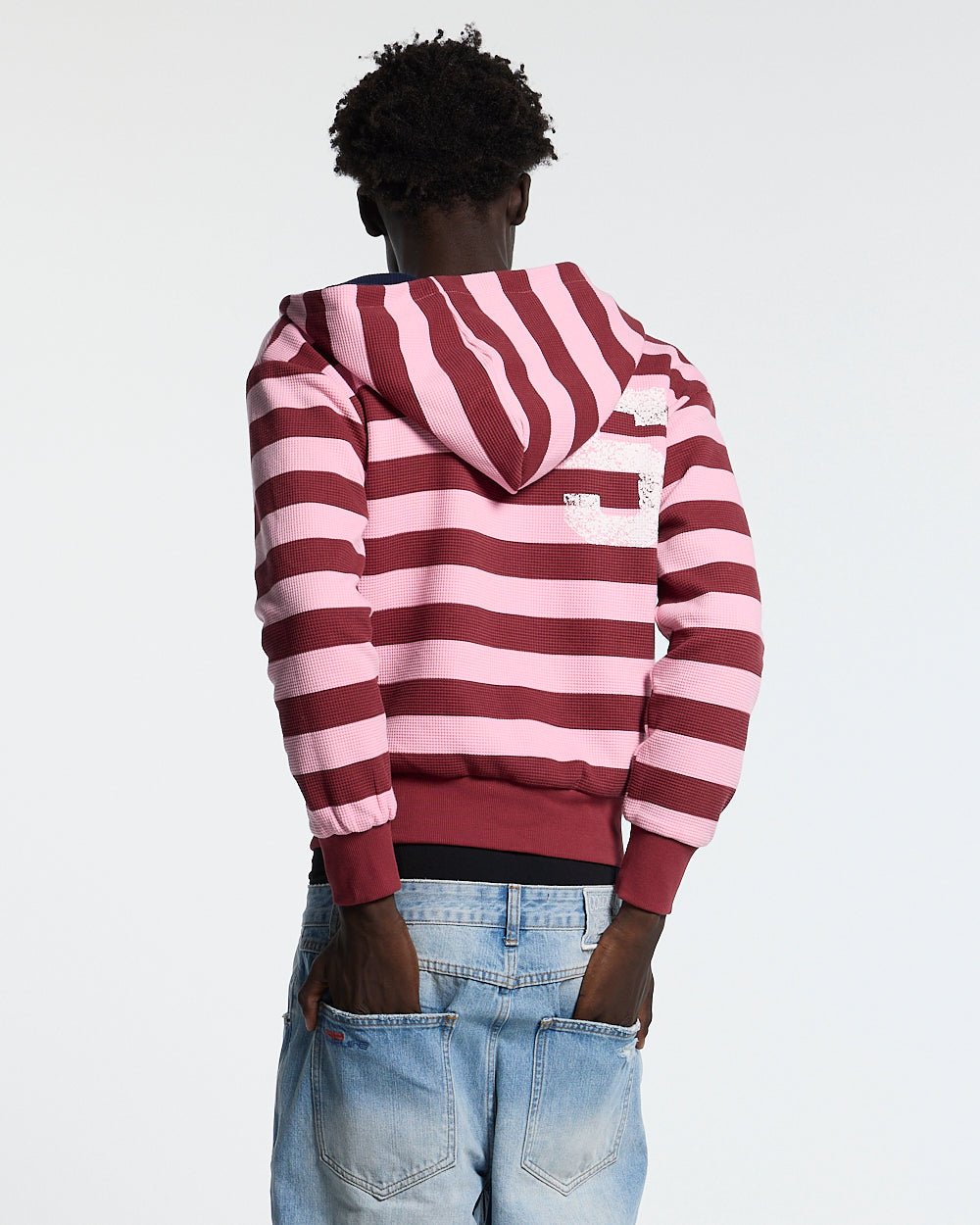 UNTRUE WAFFLE REVERSIBLE ZIP HOODIE PINK - pink striped reversible zip-up hoodie, back view on male model - Cold Culture