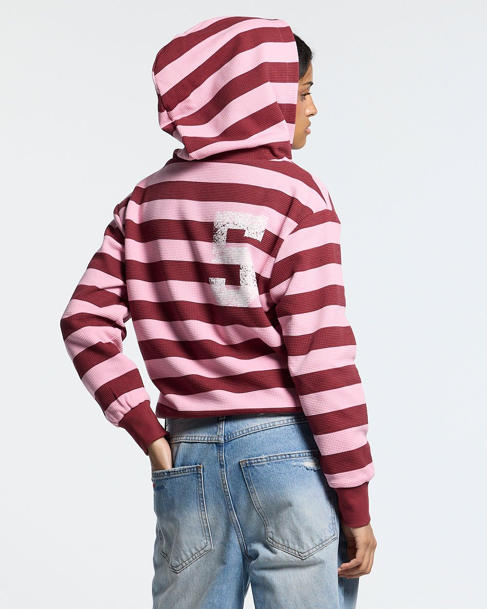 UNTRUE WAFFLE REVERSIBLE ZIP HOODIE PINK - pink striped reversible zip-up hoodie, back view on female model - Cold Culture