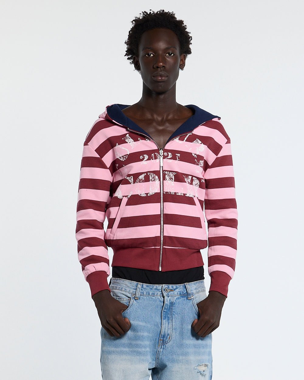 UNTRUE WAFFLE REVERSIBLE ZIP HOODIE PINK - pink striped reversible zip-up hoodie, front view on male model - Cold Culture