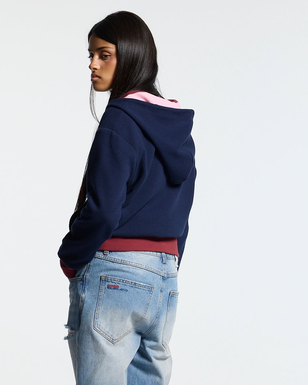 UNTRUE WAFFLE REVERSIBLE ZIP HOODIE PINK - pink striped reversible zip-up hoodie, back view on female model - Cold Culture