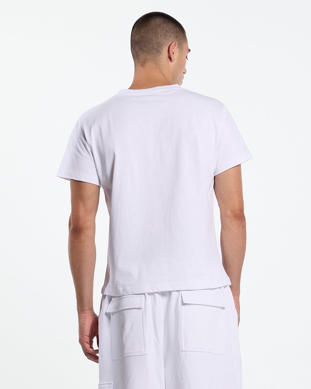 ICON TEE WHITE - white graphic print tee, back view on male model - Cold Culture